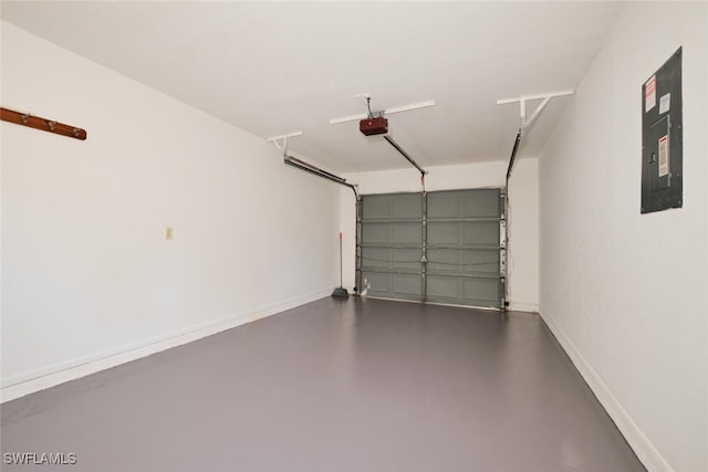 garage with electric panel and a garage door opener