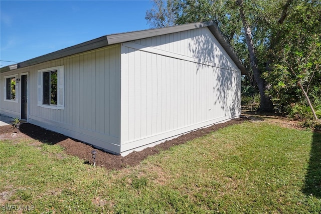 view of property exterior with a yard