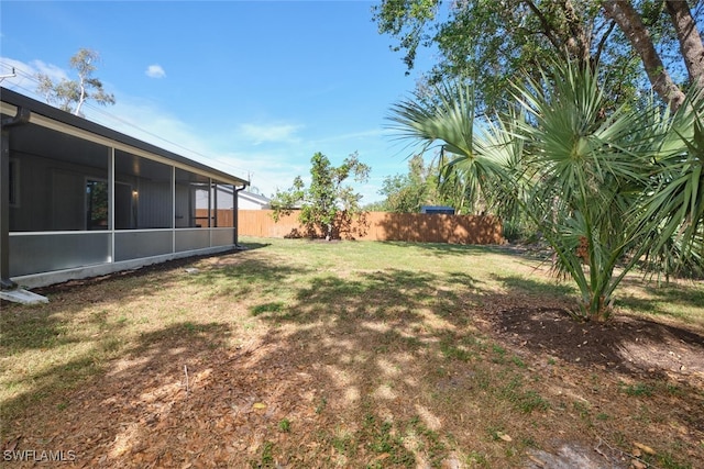 view of yard featuring a sunroom