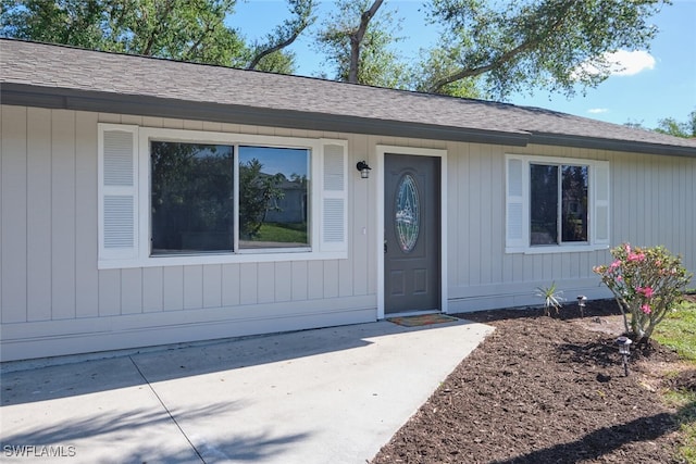 entrance to property featuring a patio area