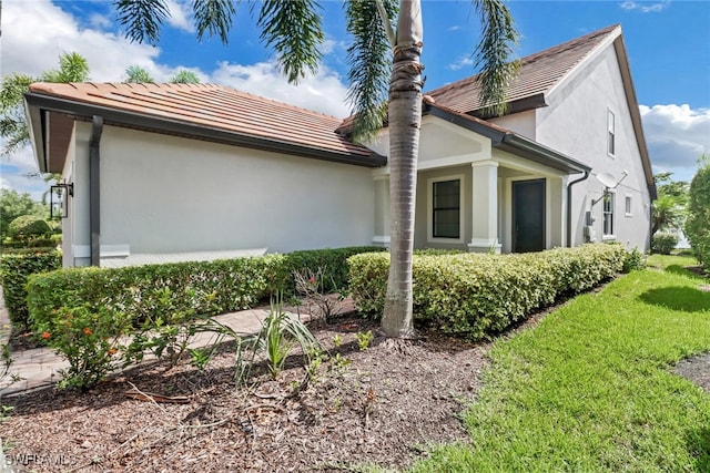 view of home's exterior featuring a lawn