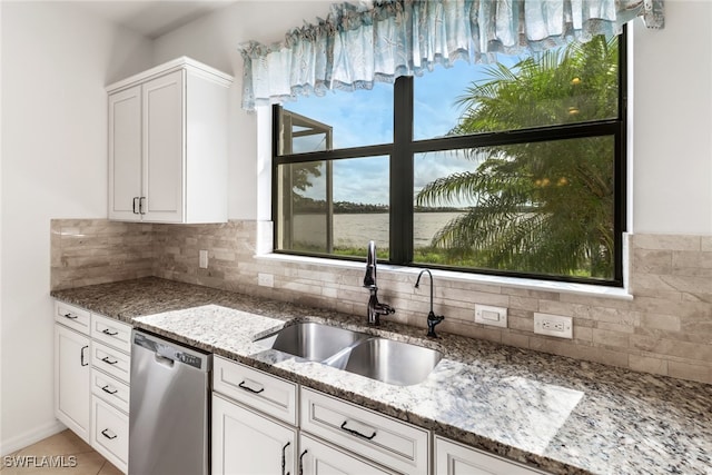 kitchen featuring sink, white cabinetry, dishwasher, and plenty of natural light