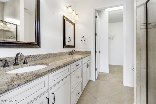 bathroom featuring vanity and tile patterned flooring