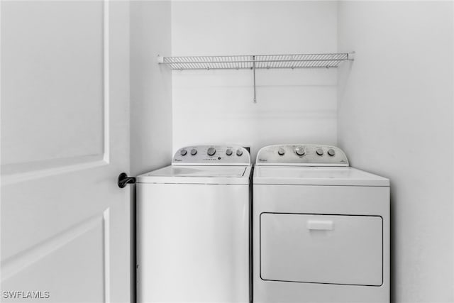 washroom with separate washer and dryer