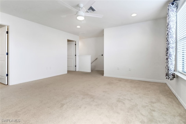 unfurnished room with light carpet and ceiling fan