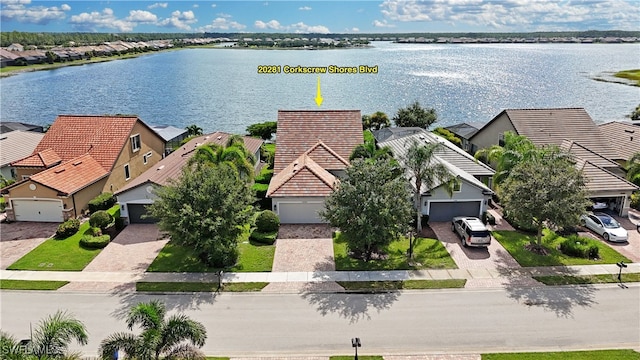 birds eye view of property featuring a water view