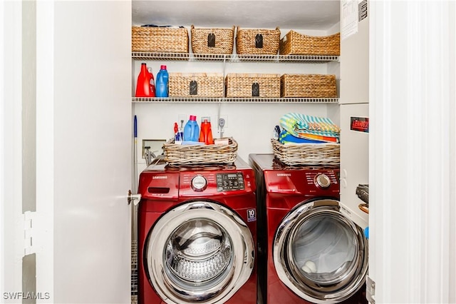 laundry room featuring washing machine and clothes dryer