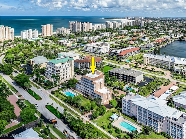 bird's eye view featuring a water view and a view of city