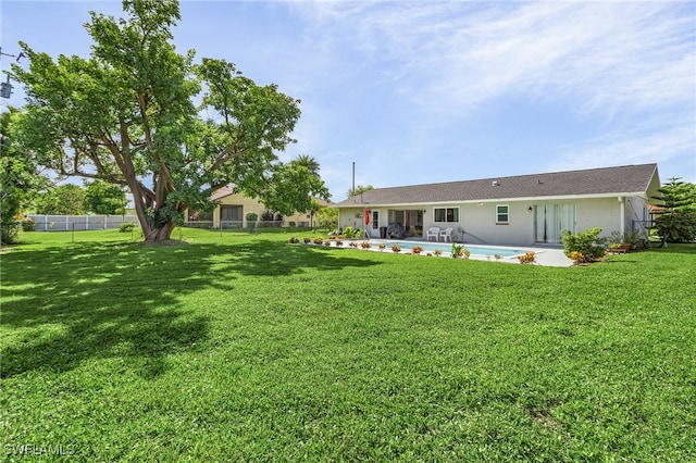 view of yard featuring a fenced in pool and a patio