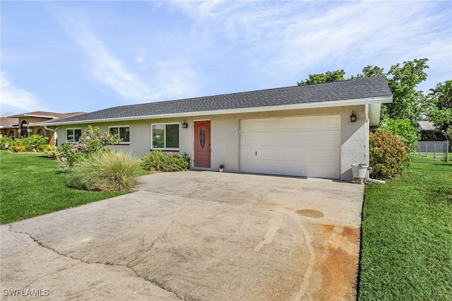 ranch-style home featuring a garage and a front yard