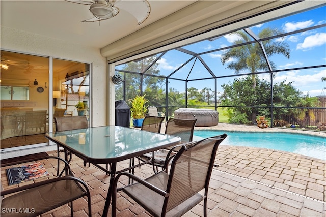 view of pool with a patio, a lanai, and ceiling fan