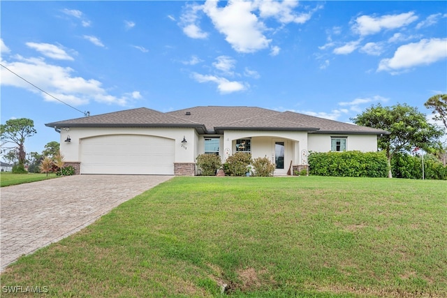 ranch-style home featuring a front yard and a garage