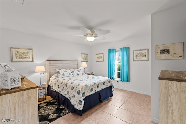 bedroom featuring ceiling fan and light tile patterned flooring