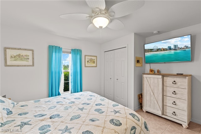 tiled bedroom with a closet and ceiling fan