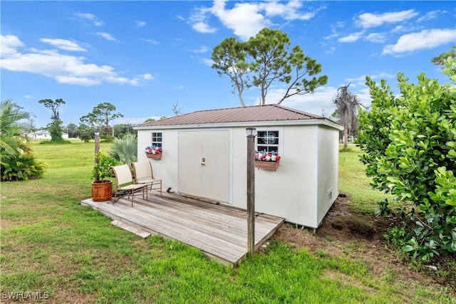 view of outdoor structure featuring a yard