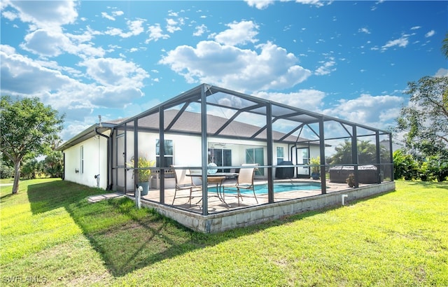 back of house with a lawn, a patio area, and glass enclosure