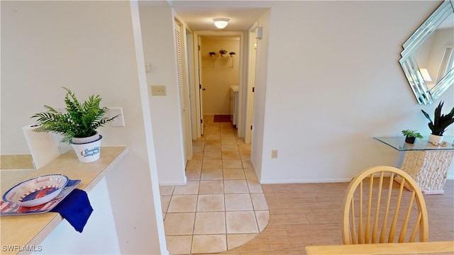 hall with light hardwood / wood-style floors