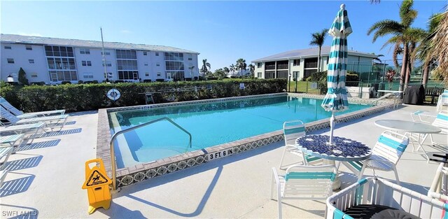 view of swimming pool featuring a patio