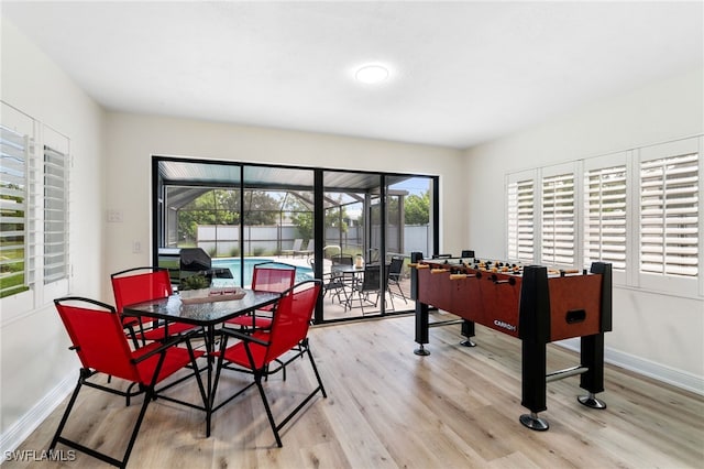 playroom featuring wood finished floors and baseboards