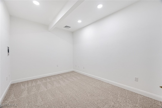 spare room featuring beam ceiling, recessed lighting, visible vents, light carpet, and baseboards