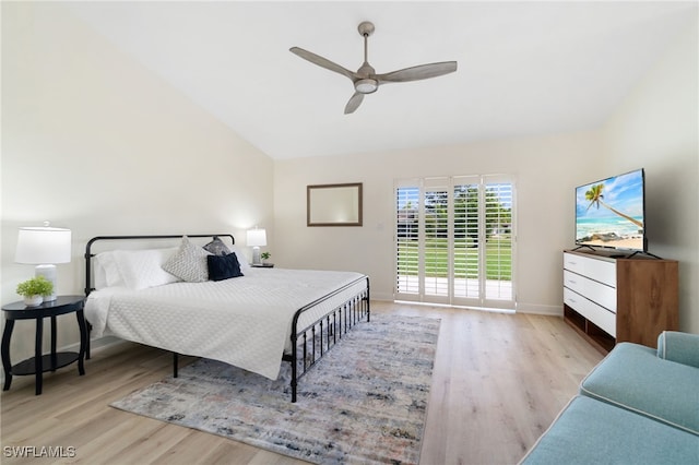 bedroom featuring a ceiling fan, lofted ceiling, baseboards, and wood finished floors