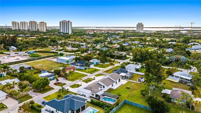 birds eye view of property featuring a city view