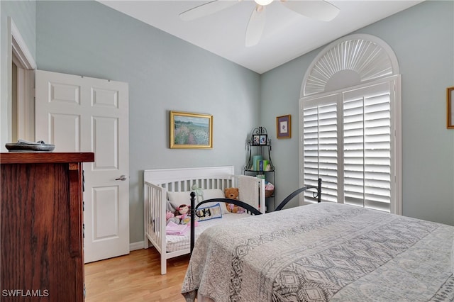 bedroom featuring light hardwood / wood-style flooring and ceiling fan