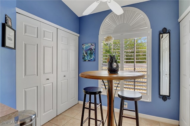 dining room featuring ceiling fan and light tile patterned flooring