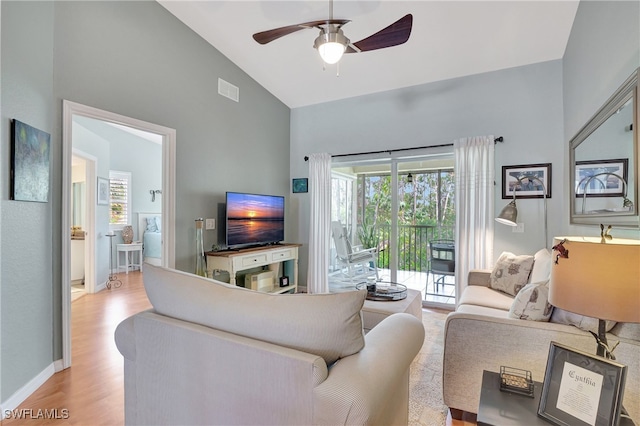 living room featuring high vaulted ceiling, ceiling fan, and light hardwood / wood-style floors