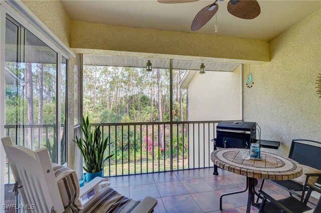 sunroom / solarium with ceiling fan