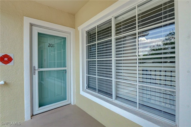 entrance to property with a balcony