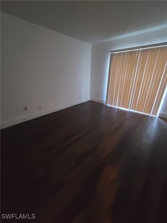 unfurnished room featuring hardwood / wood-style floors