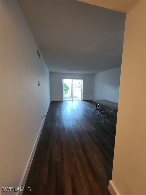 empty room featuring dark hardwood / wood-style floors