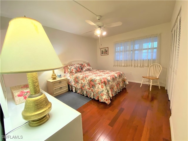 bedroom featuring ceiling fan and dark hardwood / wood-style flooring