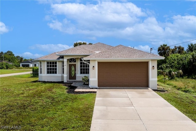 view of front facade with a garage and a front lawn