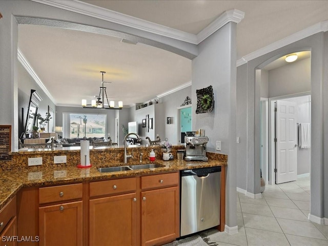 kitchen with brown cabinetry, arched walkways, a sink, dishwasher, and crown molding