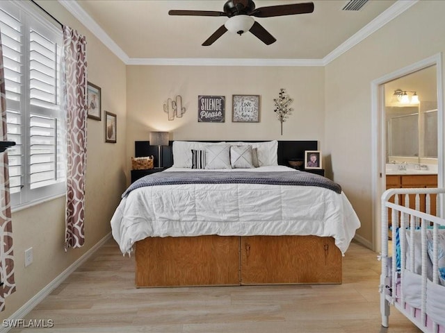 bedroom with crown molding, light wood-style floors, and baseboards