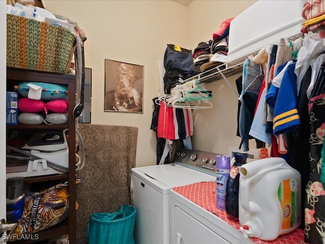 clothes washing area featuring laundry area and independent washer and dryer