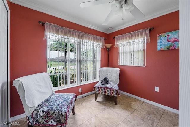 living area featuring ornamental molding, light tile patterned floors, and ceiling fan