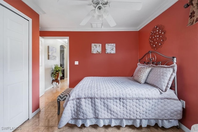 bedroom with ceiling fan and ornamental molding