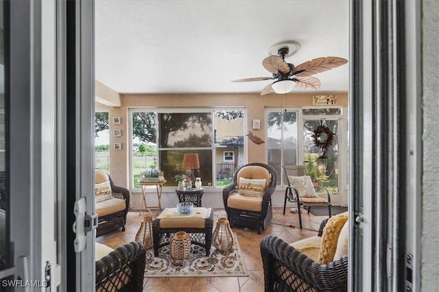 sunroom / solarium with ceiling fan