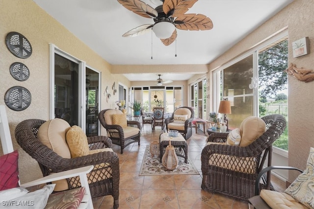 sunroom featuring a wealth of natural light and ceiling fan