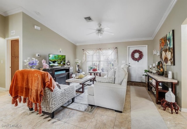 living room with lofted ceiling, ceiling fan, and ornamental molding