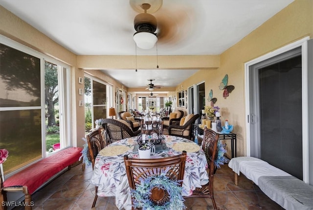 sunroom featuring ceiling fan