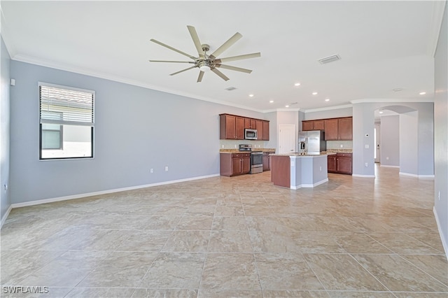 interior space with ceiling fan and ornamental molding