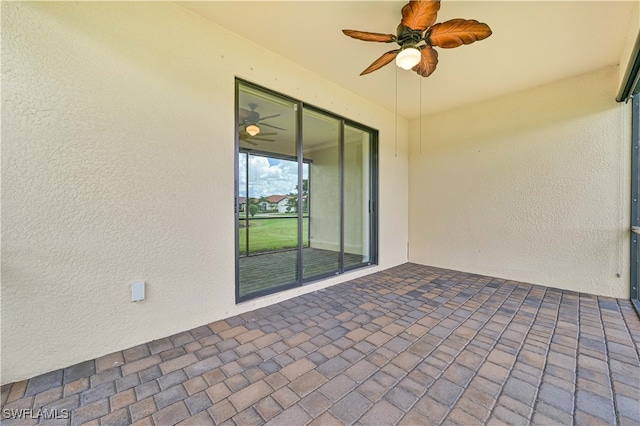 exterior space with ceiling fan