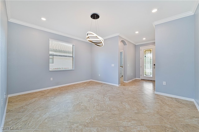 spare room featuring crown molding