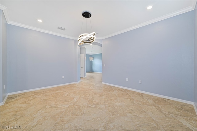 empty room featuring an inviting chandelier and ornamental molding