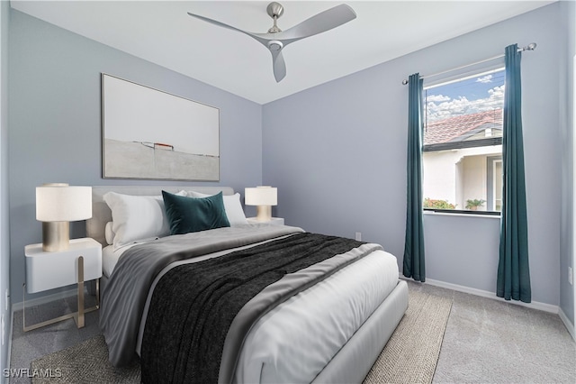 bedroom featuring ceiling fan and light carpet