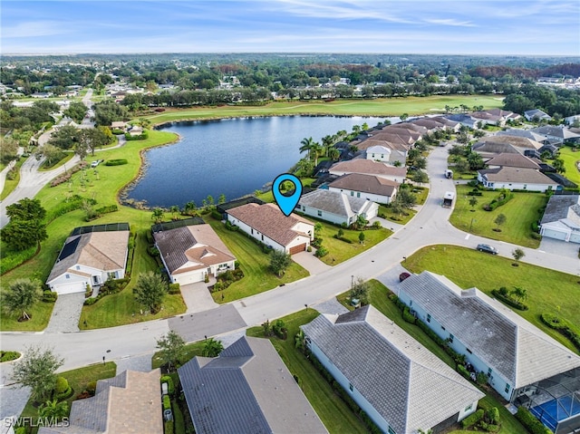 bird's eye view featuring a residential view and a water view